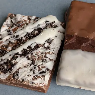 Oval Chocolate Bar with gold fleck representing the tradition and soul of chocolate making